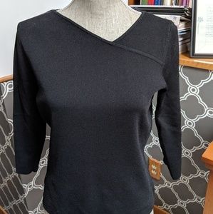Asymmetrical, three quarter sleeve black top.